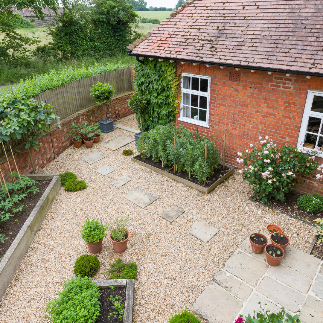 Landscaped courtyard with gravel, paving and raised beds
